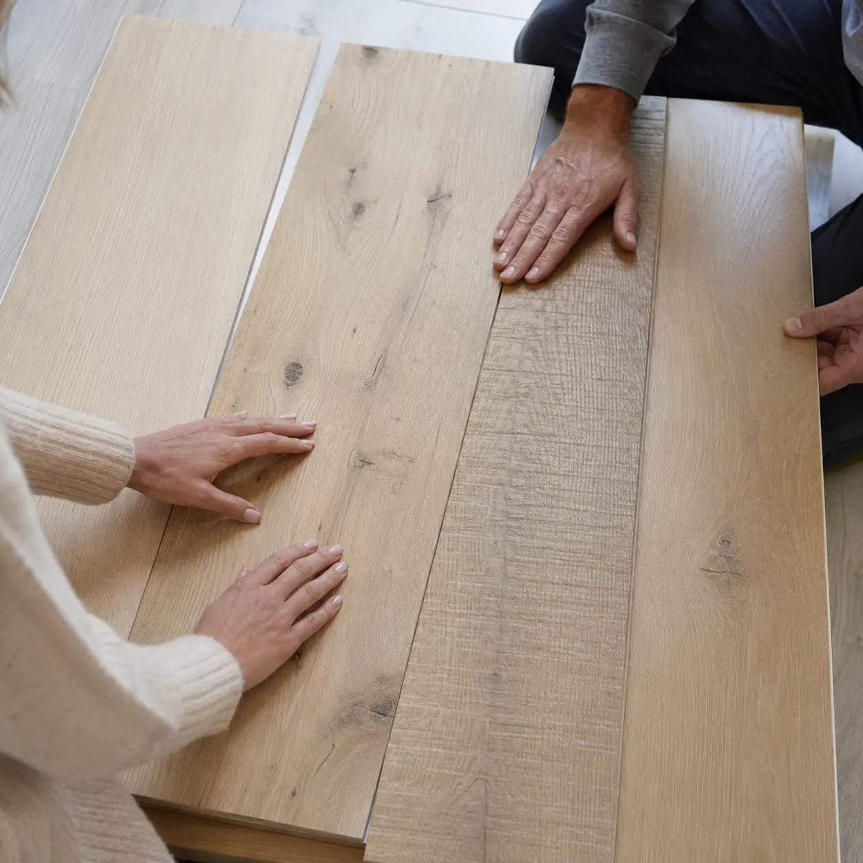 White Oak Hardwood Flooring samples showing clean grade, character grade and wire-brushed finishes