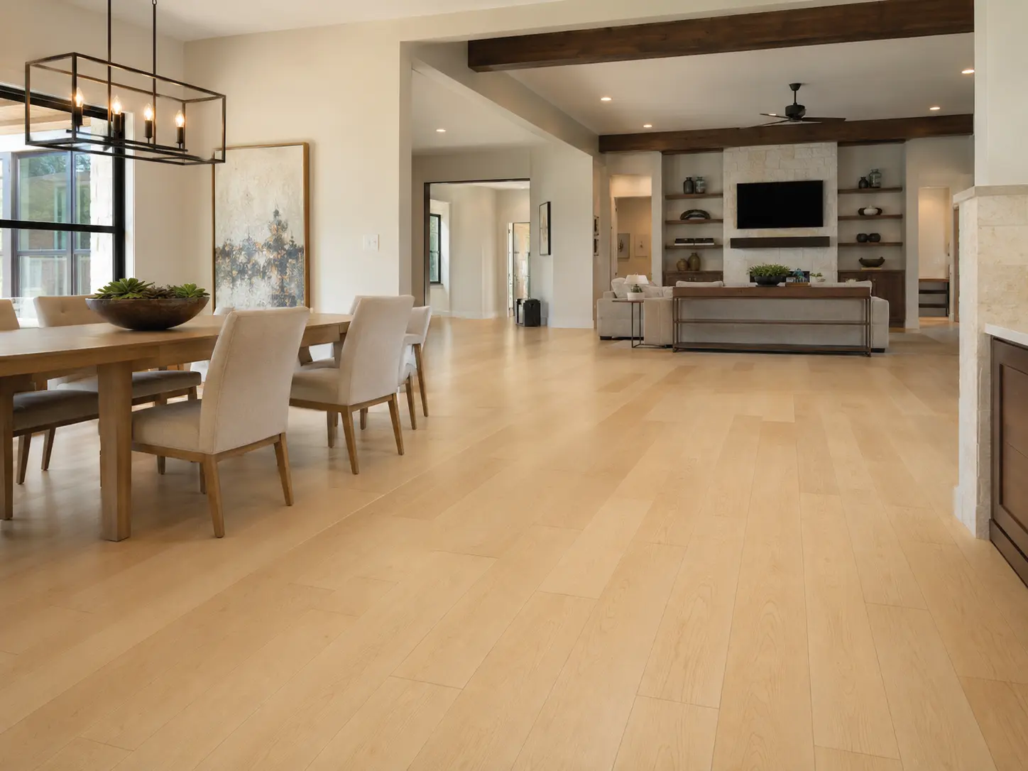Wide-plank Maple Hardwood Flooring in an open North Texas dining and living area